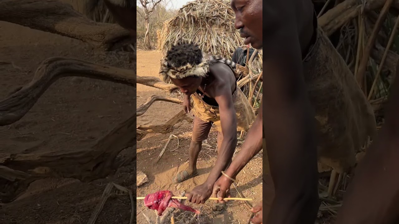 It’s lunchtime, Hadzabe men preparing their favorite meal #hadzabetribe #villagelife